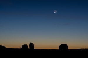 The moon over Monument Valley